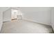 Bonus room features neutral carpet and entry into other rooms at 3725 Catawba Creek Dr, Gastonia, NC 28056