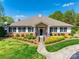Community clubhouse with manicured landscaping and charming architectural details at 3725 Catawba Creek Dr, Gastonia, NC 28056