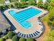 Aerial view of the community pool surrounded by trees and seating at 3725 Catawba Creek Dr, Gastonia, NC 28056