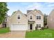 Charming two-story home with a well-maintained lawn and attached two car garage at 3725 Catawba Creek Dr, Gastonia, NC 28056