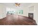 Cozy living room with a fireplace, open layout, and a view of the kitchen area at 3725 Catawba Creek Dr, Gastonia, NC 28056