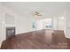 Open-concept living room with hardwood floors, fireplace, and abundant natural light at 3725 Catawba Creek Dr, Gastonia, NC 28056