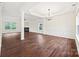 Spacious living room featuring hardwood floors, fireplace, and ample natural light at 3725 Catawba Creek Dr, Gastonia, NC 28056