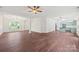 Bright, spacious living room flowing into kitchen with hardwood floors and stylish fixtures at 3725 Catawba Creek Dr, Gastonia, NC 28056