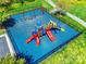 Aerial view of the community playground with slides, swings, and a safety ground at 3725 Catawba Creek Dr, Gastonia, NC 28056