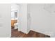 Walk-in closet near the bathroom with white walls and wood floors with wire shelving and outlets at 3725 Catawba Creek Dr, Gastonia, NC 28056