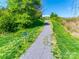 Community walking trail through natural surroundings at 3725 Catawba Creek Dr, Gastonia, NC 28056