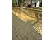 Wooden back deck showing sun-drenched planks and sturdy railing, excellent for entertaining at 3735 Stonehaven Dr, Charlotte, NC 28215