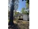 Backyard features a new deck, perfect for entertaining, and mature trees at 3735 Stonehaven Dr, Charlotte, NC 28215