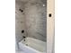 Bathroom features a shower with marbled tile and black fixtures at 3735 Stonehaven Dr, Charlotte, NC 28215