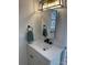 Bathroom features a modern vanity with matte black hardware and a decorative light fixture above the mirror at 3735 Stonehaven Dr, Charlotte, NC 28215