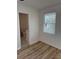 Bedroom featuring wood flooring and a view of the bathroom at 3735 Stonehaven Dr, Charlotte, NC 28215