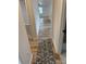 Hallway with wood floors and a patterned rug leading to other rooms at 3735 Stonehaven Dr, Charlotte, NC 28215