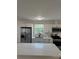 Bright kitchen featuring stainless steel appliances, white cabinets, countertop, and view from the kitchen window at 3735 Stonehaven Dr, Charlotte, NC 28215