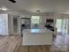 Bright kitchen featuring an island, stainless steel appliances, and white cabinets at 3735 Stonehaven Dr, Charlotte, NC 28215