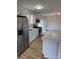 Modern kitchen with stainless steel appliances, white cabinets, and an island at 3735 Stonehaven Dr, Charlotte, NC 28215