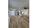 Open-concept living space featuring a kitchen island, appliances, and modern lighting at 3735 Stonehaven Dr, Charlotte, NC 28215