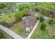 An aerial view showing the serene home and land, complete with mature trees and a pond, offering a peaceful, nature-filled setting at 3987 Taxahaw Rd, Lancaster, SC 29720