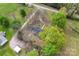 An aerial view of a property surrounded by lush trees and landscaping on a large lot at 3987 Taxahaw Rd, Lancaster, SC 29720