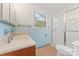 Bathroom features a window, walk-in shower, toilet, and vanity sink with a wood cabinet at 3987 Taxahaw Rd, Lancaster, SC 29720