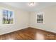 Bright bedroom with hardwood floors, two windows, offering plenty of natural light at 3987 Taxahaw Rd, Lancaster, SC 29720