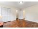 Bright bedroom boasts hardwood floors, neutral walls, and closet for ample storage space at 3987 Taxahaw Rd, Lancaster, SC 29720