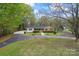 Inviting single-story home with mature landscaping and a long driveway at 3987 Taxahaw Rd, Lancaster, SC 29720