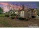 Charming brick home featuring a cozy back porch and landscaped backyard enhanced at 3987 Taxahaw Rd, Lancaster, SC 29720