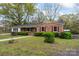 Cozy brick home with well-manicured lawn and lush landscaping at 3987 Taxahaw Rd, Lancaster, SC 29720