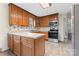 Traditional kitchen with wood cabinets and stainless steel appliances at 3987 Taxahaw Rd, Lancaster, SC 29720