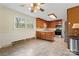 Spacious eat-in kitchen features wood cabinets and stainless steel appliances at 3987 Taxahaw Rd, Lancaster, SC 29720