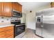 Cozy kitchen with stainless steel oven, microwave, and refrigerator appliances at 3987 Taxahaw Rd, Lancaster, SC 29720