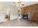 Living room featuring brick fireplace and views into other rooms at 3987 Taxahaw Rd, Lancaster, SC 29720
