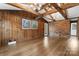 Living room with wood floors and wood paneled walls at 3987 Taxahaw Rd, Lancaster, SC 29720
