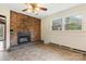 Living room with brick fireplace and views of the yard at 3987 Taxahaw Rd, Lancaster, SC 29720