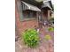 Traditional brick home with awnings and landscaped yard at 4331 Knollcrest Dr, Charlotte, NC 28208