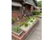 Charming brick home with a well-manicured front yard and walkway at 4331 Knollcrest Dr, Charlotte, NC 28208