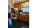 Well-lit kitchen featuring wooden cabinets, modern appliances, and tiled countertops at 4331 Knollcrest Dr, Charlotte, NC 28208