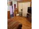 Cozy living room featuring wood paneling and a comfortable striped sofa at 4331 Knollcrest Dr, Charlotte, NC 28208