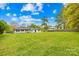 Large backyard features a well-maintained lawn and a view of the house, perfect for outdoor activities at 504 Katherine Ave, Kings Mountain, NC 28086