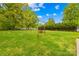 Spacious backyard with lush green grass and a swing set provides ample space for recreation and relaxation at 504 Katherine Ave, Kings Mountain, NC 28086
