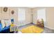 Cozy room that features bright, natural light, yellow accents, and sleek, gray-painted flooring at 504 Katherine Ave, Kings Mountain, NC 28086