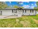 Charming single-story house has a white exterior, a driveway, and a well-maintained lawn at 504 Katherine Ave, Kings Mountain, NC 28086