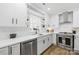 Bright white kitchen with stainless steel appliances, and undermount sink at 504 Katherine Ave, Kings Mountain, NC 28086