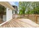 Backyard features a spacious wooden deck with access to sliding glass doors into the home at 5316 Teakwood Dr, Kannapolis, NC 28083