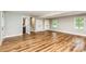 Large basement area with wood-look floors, access to the bathroom, and stairway access to upper level at 5316 Teakwood Dr, Kannapolis, NC 28083