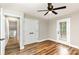 Bedroom features a ceiling fan, wood grain floors, closet, and outdoor access at 5316 Teakwood Dr, Kannapolis, NC 28083