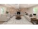 Cozy living room features a brick fireplace, comfortable seating, and lots of natural light at 5316 Teakwood Dr, Kannapolis, NC 28083