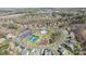 Overhead view highlighting the neighborhood's community center, pool, tennis courts and lush landscaping at 7116 Brookline Pl, Huntersville, NC 28078