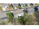 This is an aerial view of a home in the summer with green grass and mature trees surrounding the property at 7116 Brookline Pl, Huntersville, NC 28078